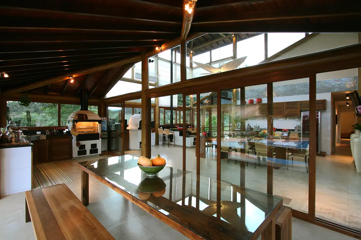 Dining room inside a timber-framed glass extension