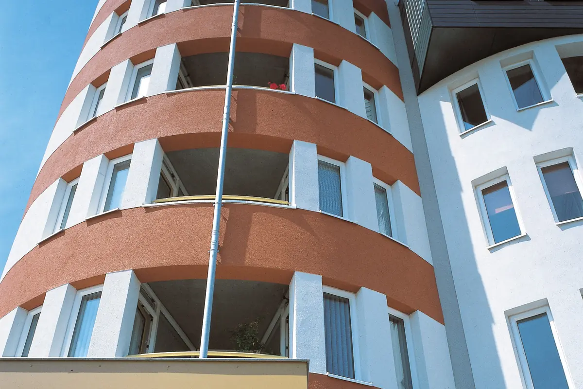Curved residential block with rows of balconies
