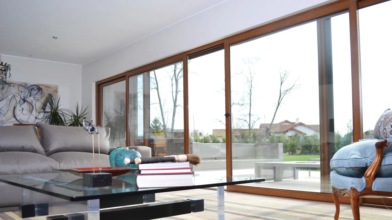 Living room with a wide wood-effect sliding door onto a garden